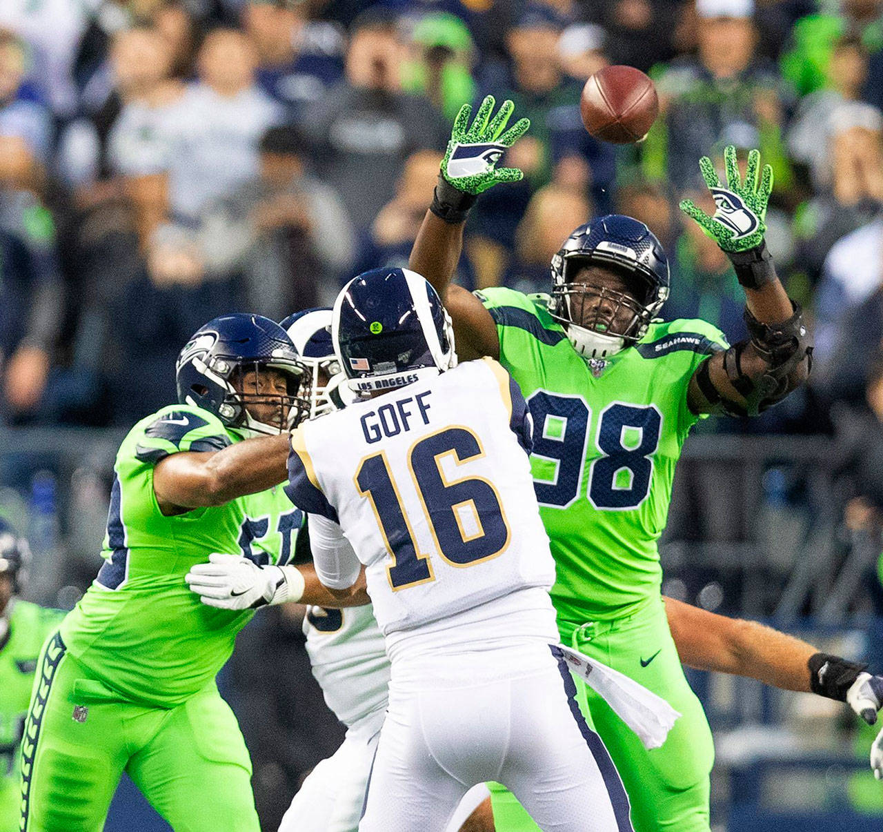 Seattle Seahawks linebacker K.J. Wright, left and defensive end Rasheem Green (98) pressure Los Angeles Rams quarterback Jared Goff (16) at CenturyLink Field in Seattle on Thursday, Oct. 3, 2019. (Mike Siegel/Seattle Times/TNS)