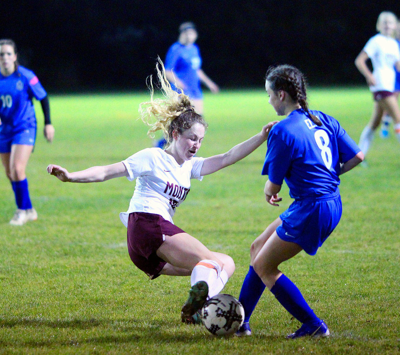 Montesanos Brooke Streeter executes a slide tackle to get the ball away from Elmas Janessa Sample in the second half of a match on Tuesday in Elma. (Hasani Grayson | Grays Harbor News Group)