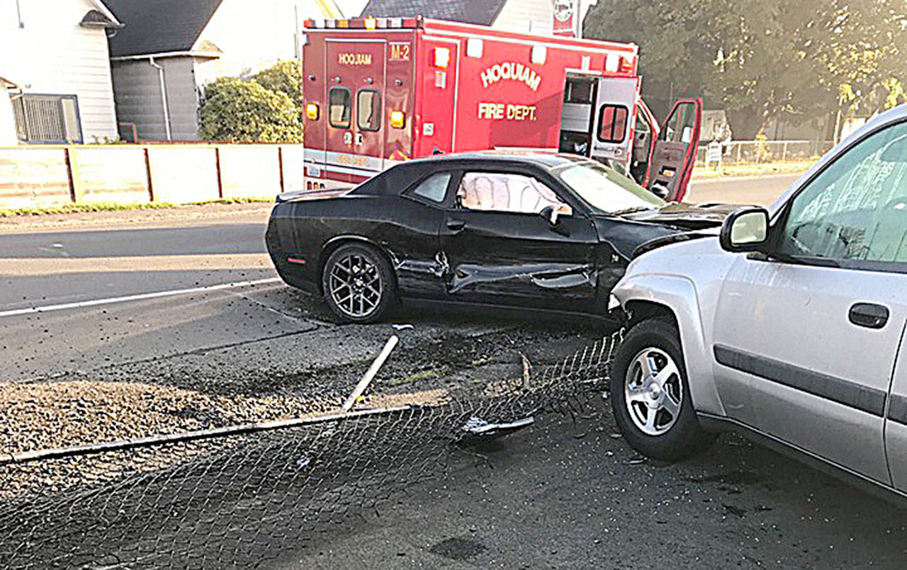 COURTESY HOQUIAM POLICE DEPARTMENT                                A Dodge Charger driven by a 19-year-old Hoquiam man crashed through the fence at Hot Rod Alley on Simpson Avenue Thursday morning, damaging the Challenger and six cars in the lot.