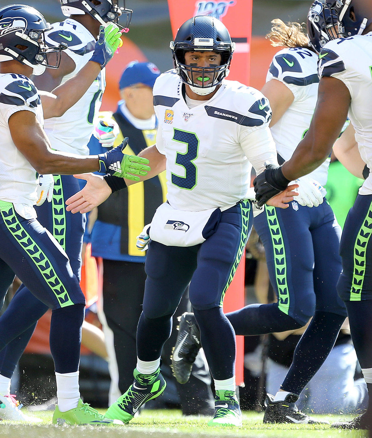 Seattle Seahawks quarterback Russell Wilson is congratulated after running in for a touchdown during the first quarter against the Cleveland Browns at FirstEnergy Stadium on Sunday. (Joshua Gunter | cleveland.com)