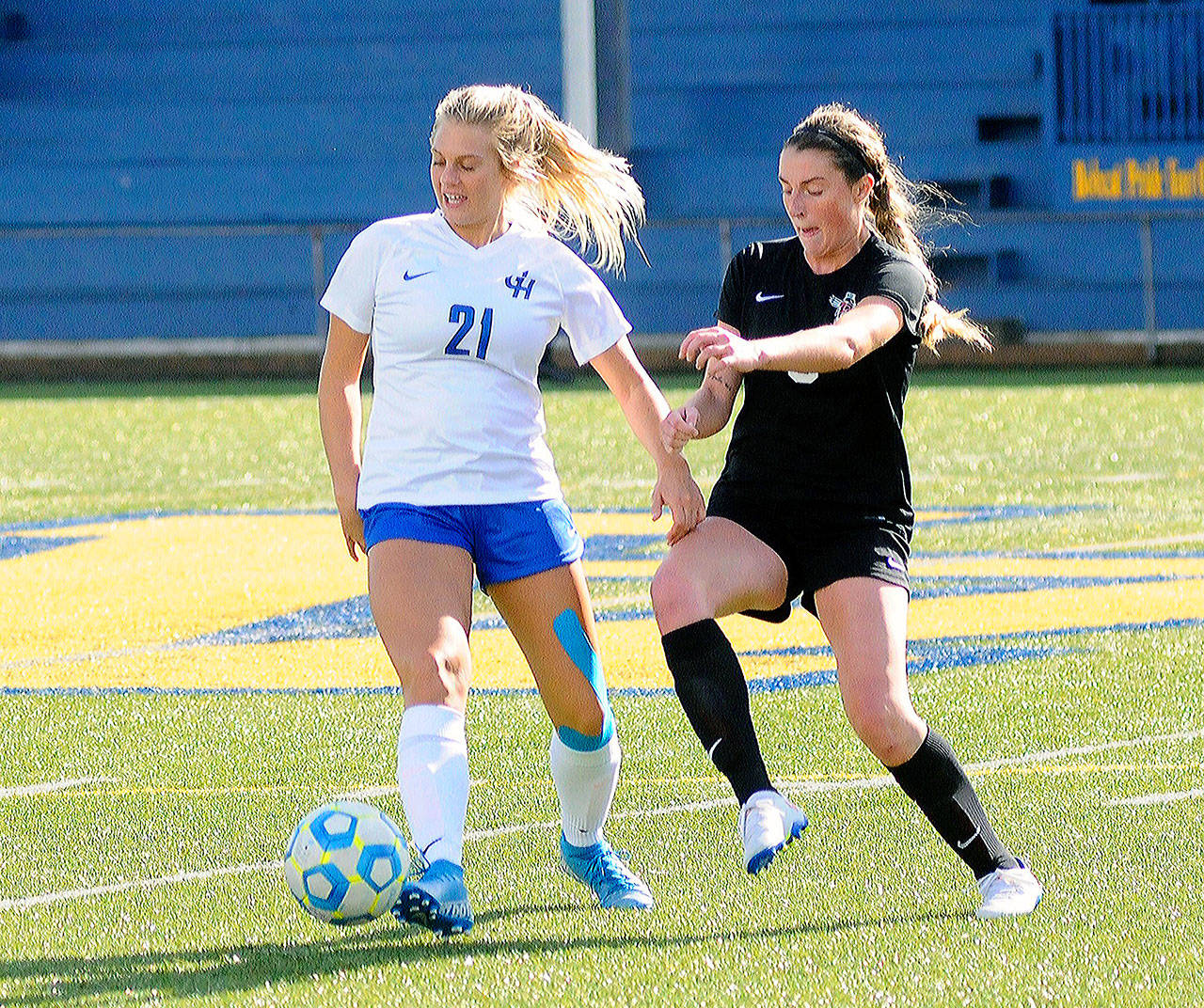 Grays Harbor’s Krislyn Koler, left, tries to shield the ball from Pierce’s Allison Cunningham in the second half of game on Saturday at Stewart Field in Aberdeen. (Hasani Grayson | Grays Harbor News Group)