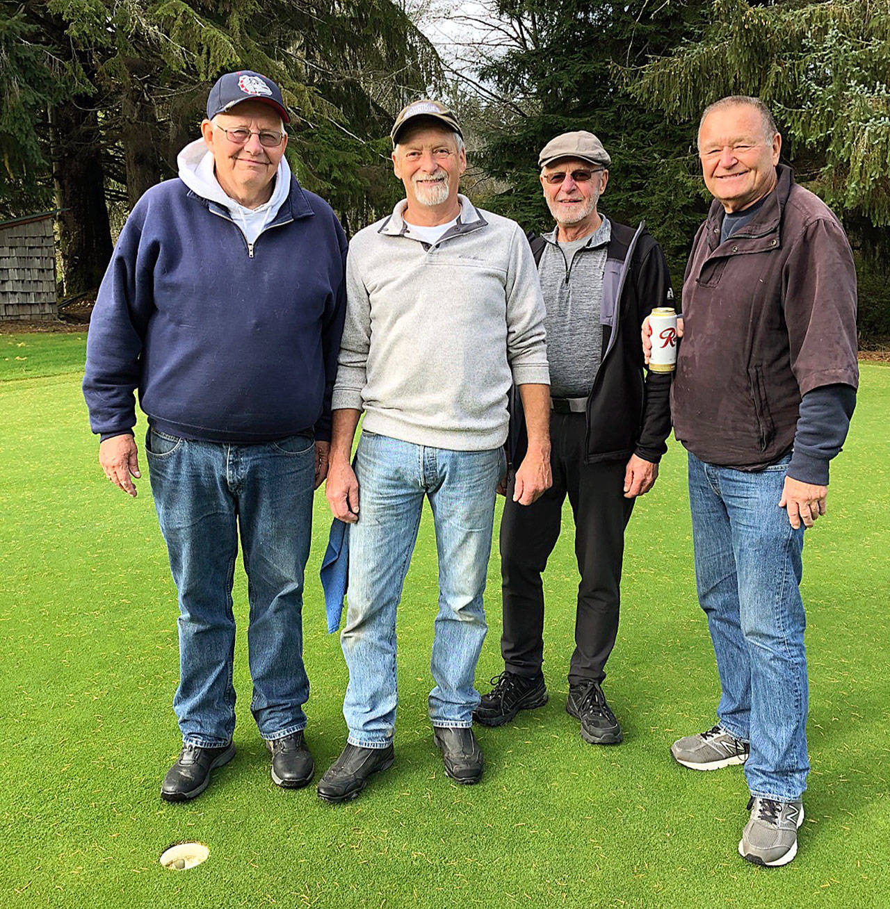 Bob Smith, second from left, is pictured with (from left) Doug King, Ed Coyle and Dave Scure after shooting an ace at Highland Golf Course on Tuesday. (Submitted photo)