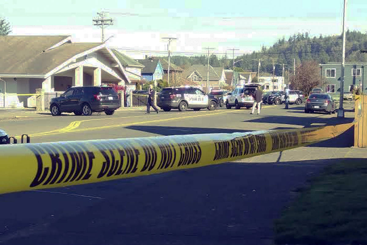 Dave Haerle | Grays Harbor News Group                                Investigators arrive to process the scene of a midday officer-involved shooting in the 300 block of East Market Street in Aberdeen Thursday.