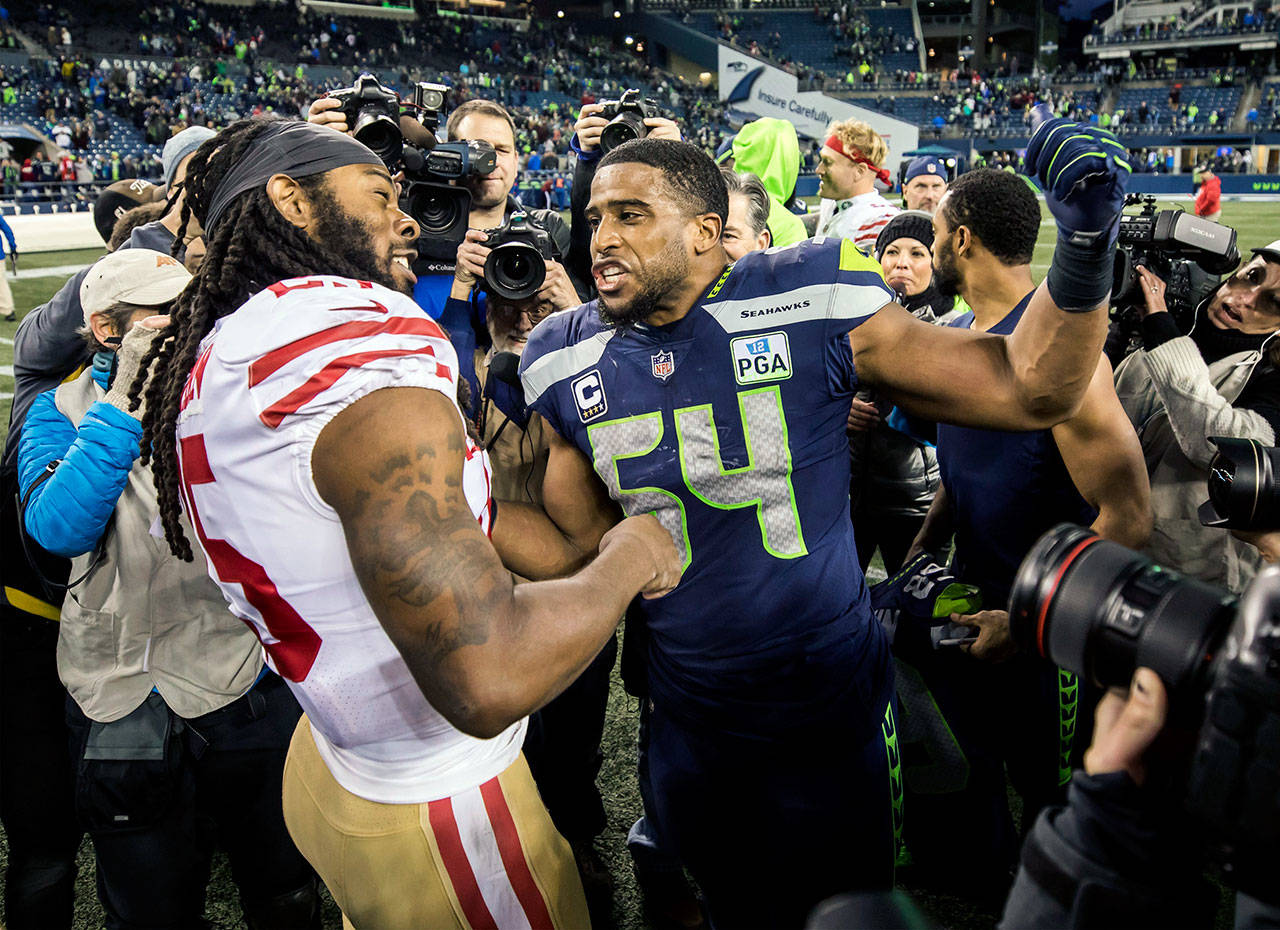 San Francisco 49ers cornerback Richard Sherman and Seattle Seahawks middle linebacker Bobby Wagner give each other some good-natured smack talk after the game on Sunday, Dec. 2, 2018 at CenturyLink Field in Seattle, Wash. (Bettina Hansen/Seattle Times/TNS)