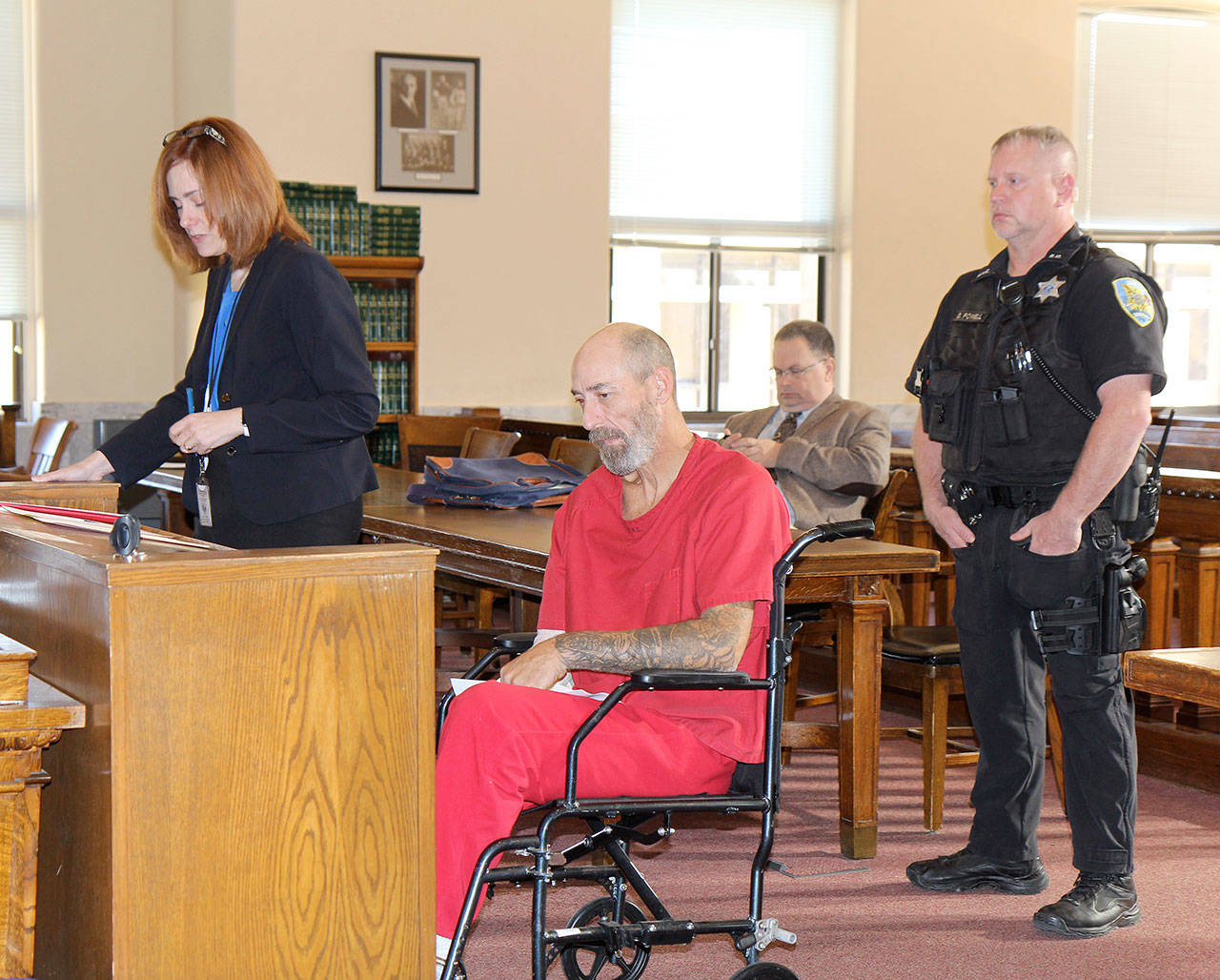 Gary Peterson (second from left) appears Wednesday, Oct. 30, 2019, in Grays Harbor County Superior Court on charges of second degree assault and hit-and-run of an attended vehicle. (Michael Lang | Grays Harbor News Group)