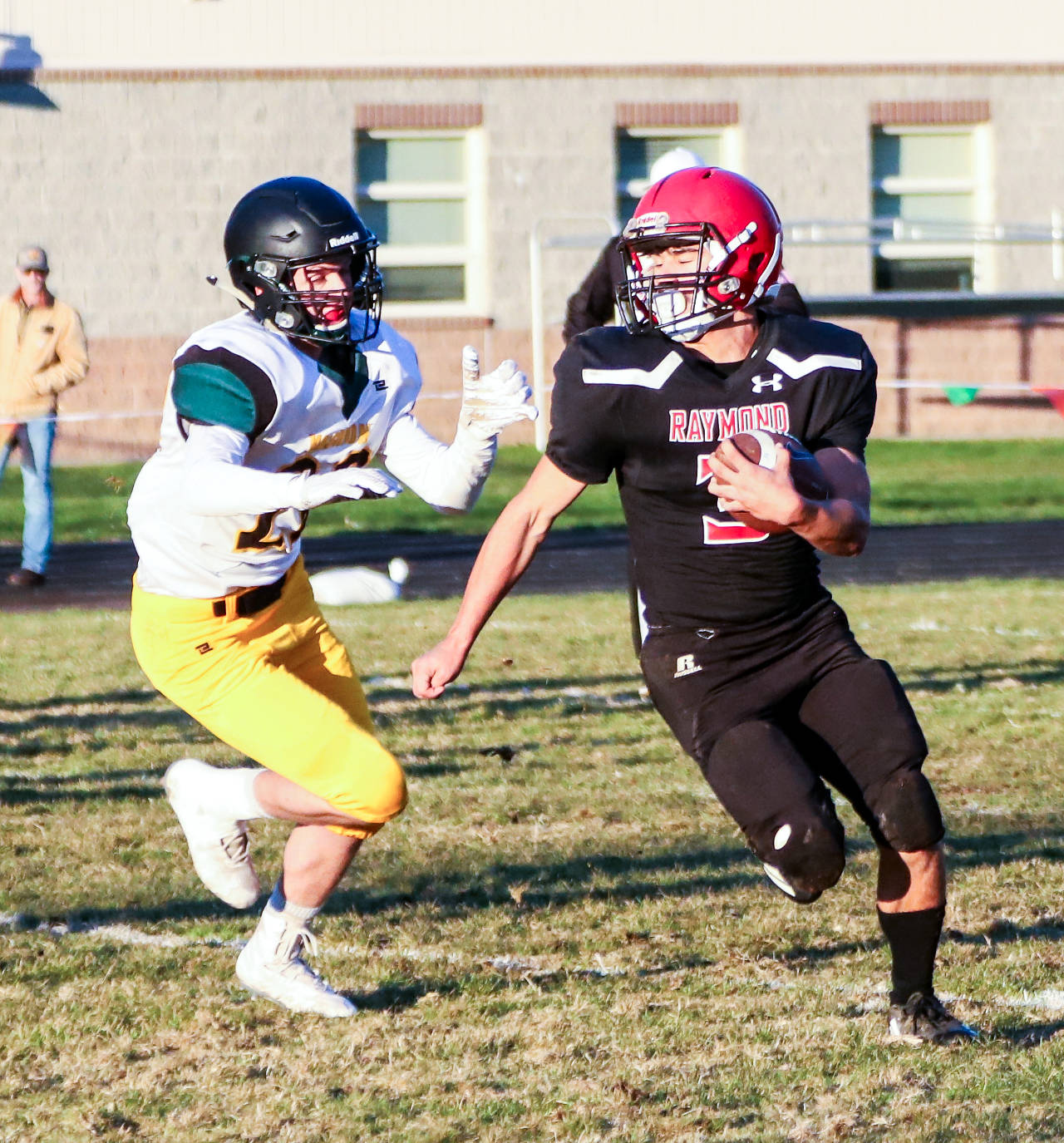 Raymond running back Joseph Vilalpando, right, carries the football during Friday’s victory over Vashon Island in Raymond. Villalpando accounted for 216 total yards of offense in the Seagulls’ 21-7 win. (Photo by Larry Bale)