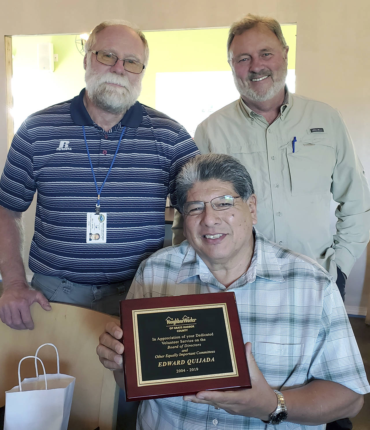 Courtesy photo                                NeighborWorks of Grays Harbor recently honored Edward Quijada, center, for his longtime work on the board. Quijada, who recently retired as Hoquiam branch manager of Bank of the Pacific, is flanked by board president Bill Sidor, left, and executive director Dave Murnen. During his tenure since 2004, Quijada is a past board president and has served on a variety of committees. NeighborWorks is a nonprofit organization that works to provide safe, affordable housing for the people of Grays Harbor County.