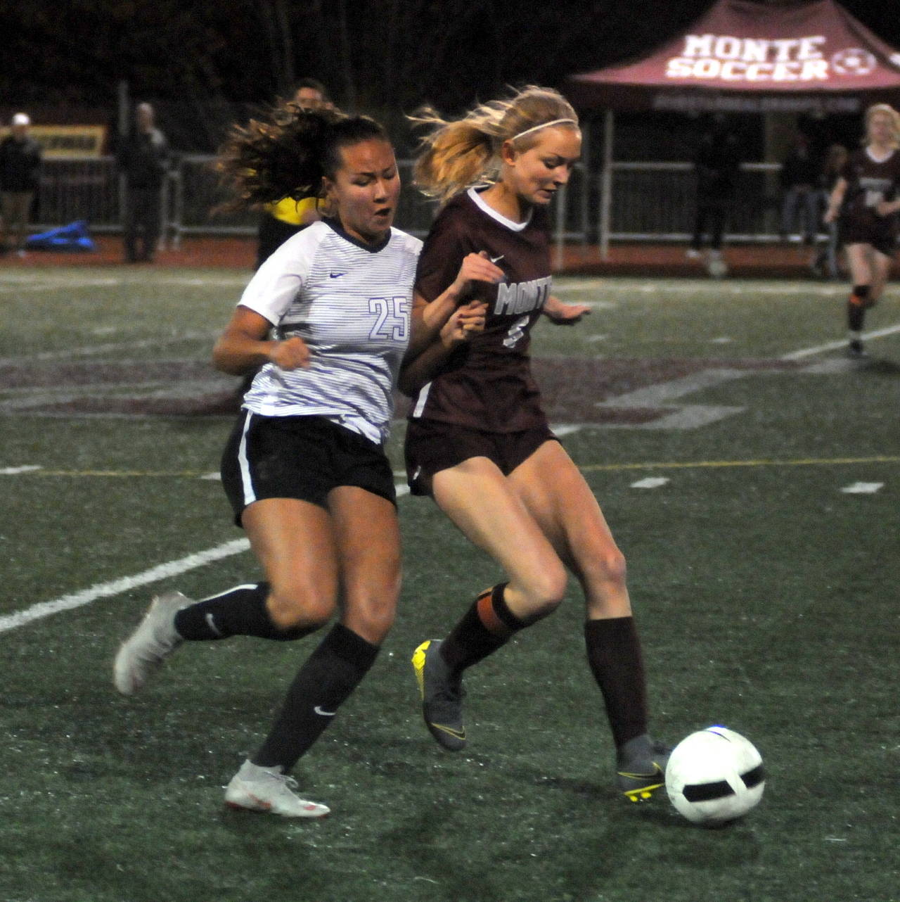 Montesano forward Anna Ayres, right, holds possession against The Bush School’s Claudia Abram during the Bulldogs’ 2-1 loss against the Blazers in a 1A State Tournament game on Wednesday at Montesano High School. (Ryan Sparks | Grays Harbor News Group)