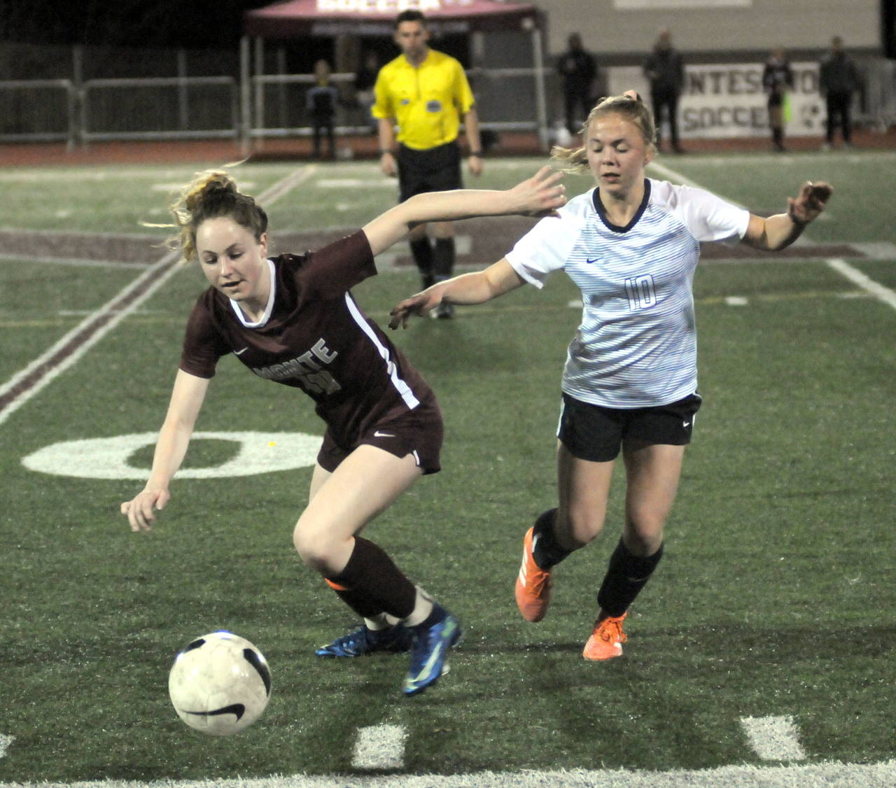 Montesano midfielder Brooke Streeter, left, competes with The Bush School’s Elle Jones during a 1A state playoff game on Wednesday at Jack Rottle Field. (Ryan Sparks | Grays Harbor News Group)