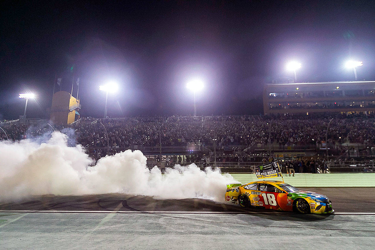Kyle Busch (18) burns out after winning the Homestead-Miami Speedway NASCAR 21st Annual Ford EcoBoost 400 Monster Energy Series on Sunday, Nov. 17, 2019 in Homestead, Fla. (Matias J. Ocner/Miami Herald/TNS)