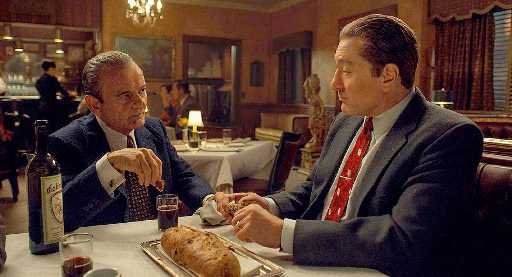 Joe Pesci, left, who portrays Russell Bufalino and Robert De Niro as Frank Sheeran in a scene from “The Irishman.” (Netflix)