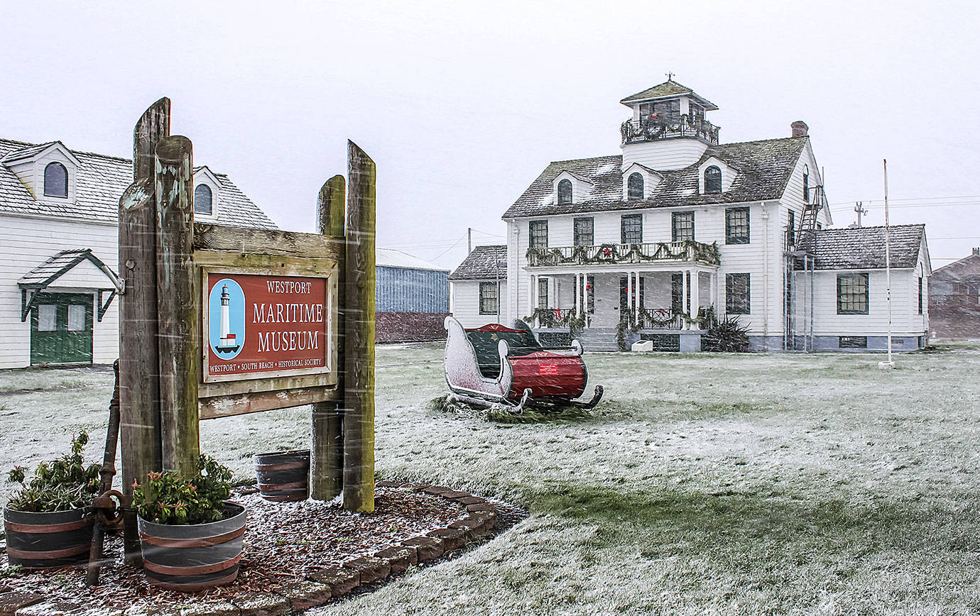 COURTESY PHOTO                                Santa’s sleigh parked in front of the Westport Maritime Museum amid a light dusting of snow.