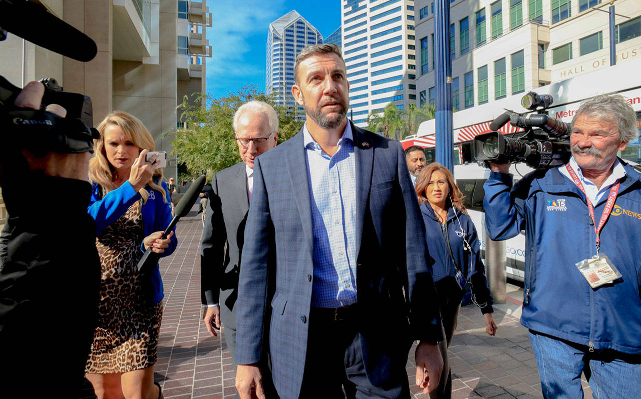 Congressman Duncan Hunter arrives just outside of Federal Courthouse late Monday morning in San Diego. (Nelvin C. Cepeda/San Diego Union)