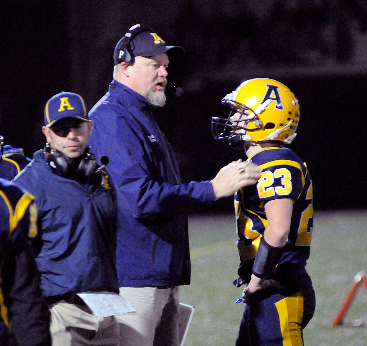 Aberdeen football head coach Todd Bridge, middle, provides instruction to Garrett Springer during a game earlier this season. Bridge and the Bobcats were awarded with the South Sound Football Officials Association’s Sportsmanship Award for 2A, 3A and 4A schools on Monday. (Ryan Sparks |Grays Harbor News Group)