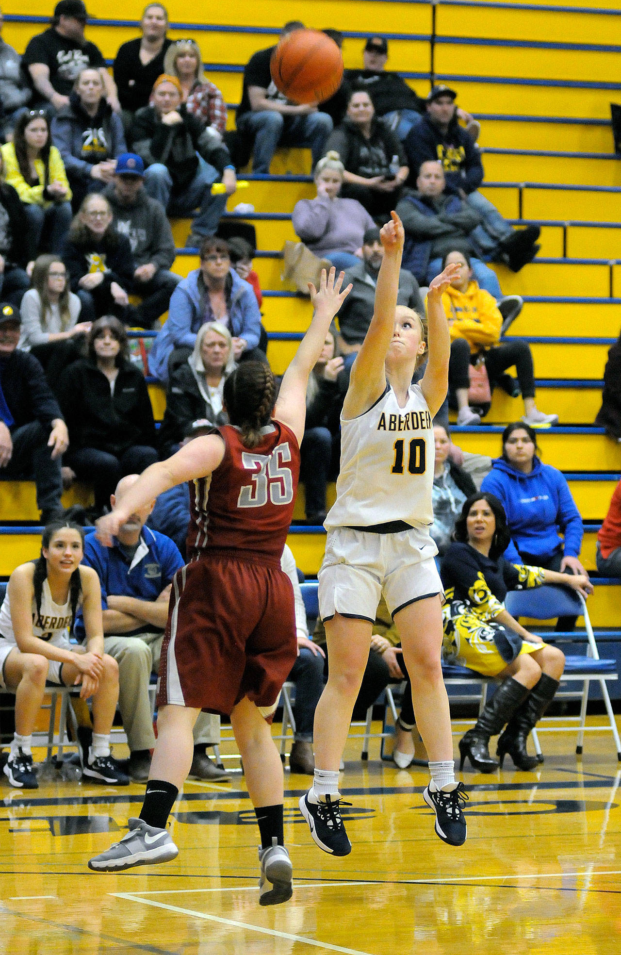 Aberdeen senior Emmy Walsh (10) puts up a shot while being defended by Hoquiam’s Taylor Strom during the Bobcats’ 54-37 victory on Wednesday at Aberdeen High School. Walsh scored 14 points in the contest. (Ryan Sparks | Grays Harbor News Group)