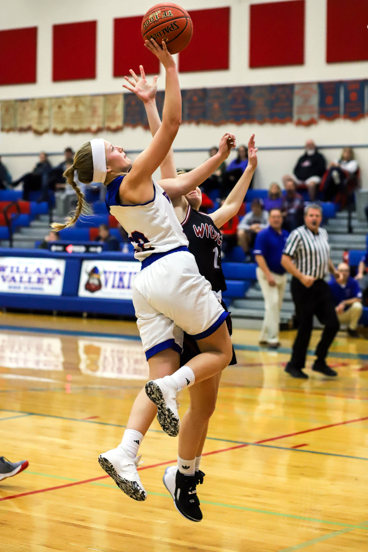 Willapa Valley’s Katie Adkins scores two points against Ocosta on Wednesday in Menlo. Adkins scored 11 points and grabbed eight rebounds in the Vikings’ 50-17 win over the Wildcats. (Photo by Larry Bale)