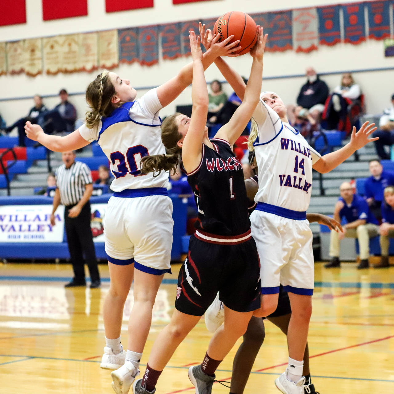 Ocosta’s Katelynn Denny, middle, is defended by Willapa Valley’s Cami Swartz (30) and Britney Patrick during Wednesday’s game at Willapa Valley High School. (Photo by Larry Bale)