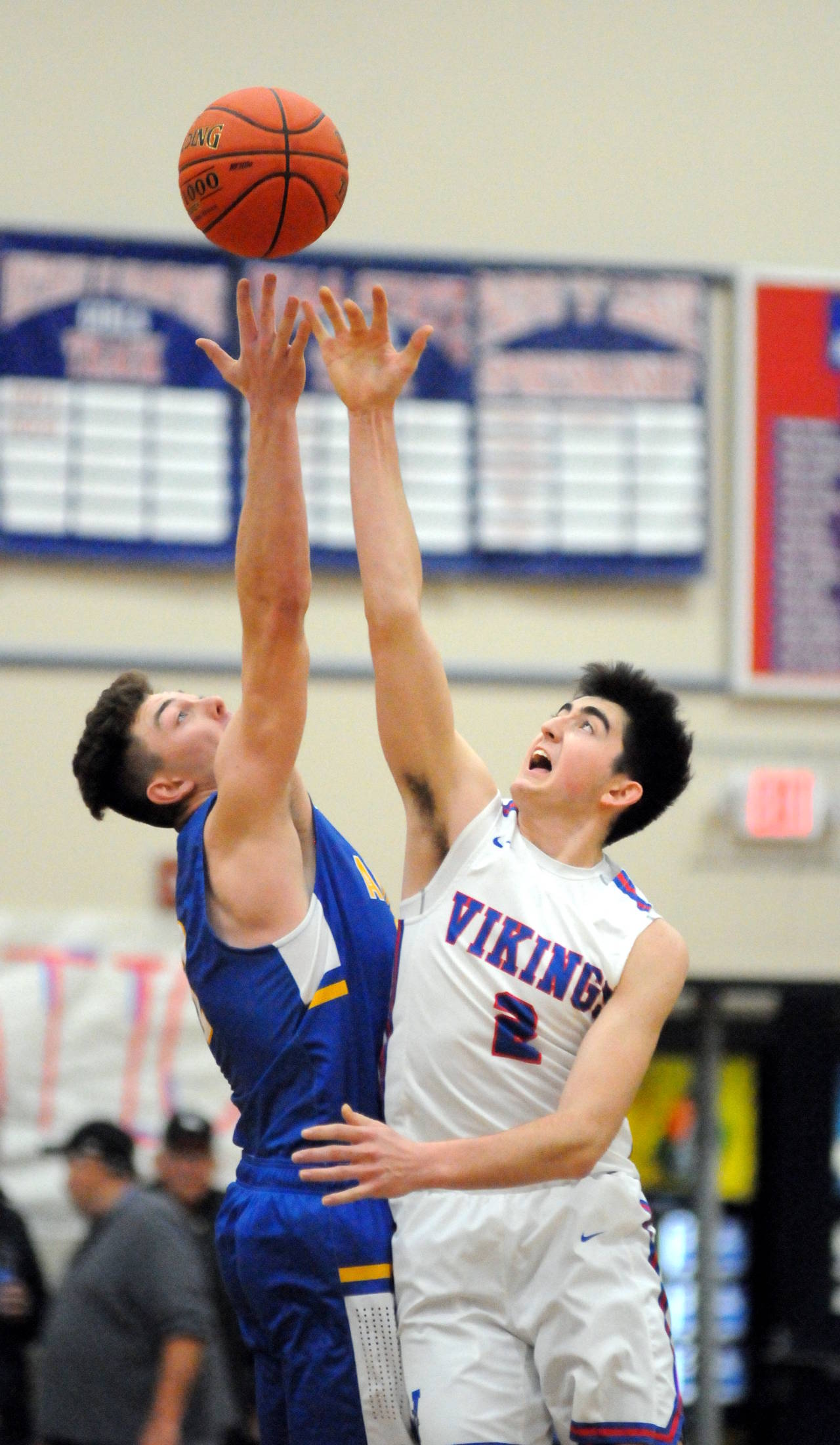 Willapa Valley’s Logan Walker (2) rises for the opening tip against Adna’s Braden Thomas during the Vikings’ 46-40 victory in the final game of the John Q. Pearson Holiday Classic on Saturday at Willapa Valley High School. (Ryan Sparks | Grays Harbor News Group)