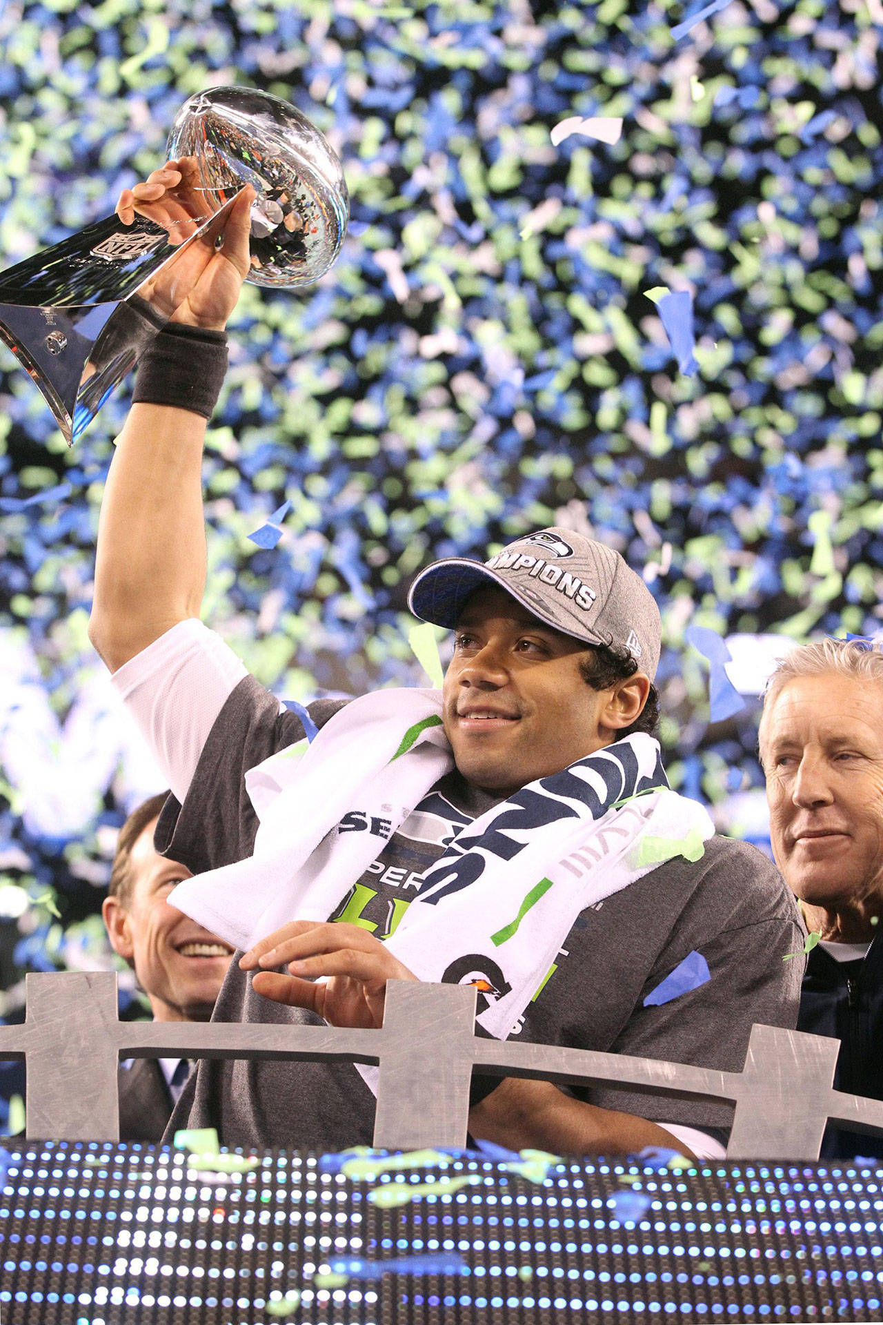 Seattle Seahawks quarterback Russell Wilson raises the Lombardi trophy after a 43-8 victory against the Denver Broncos in Super Bowl XLVIII at MetLife Stadium in East Rutherford, N.J., on Sunday, Feb. 2, 2014. (Tony Overman/The Olympian/MCT)