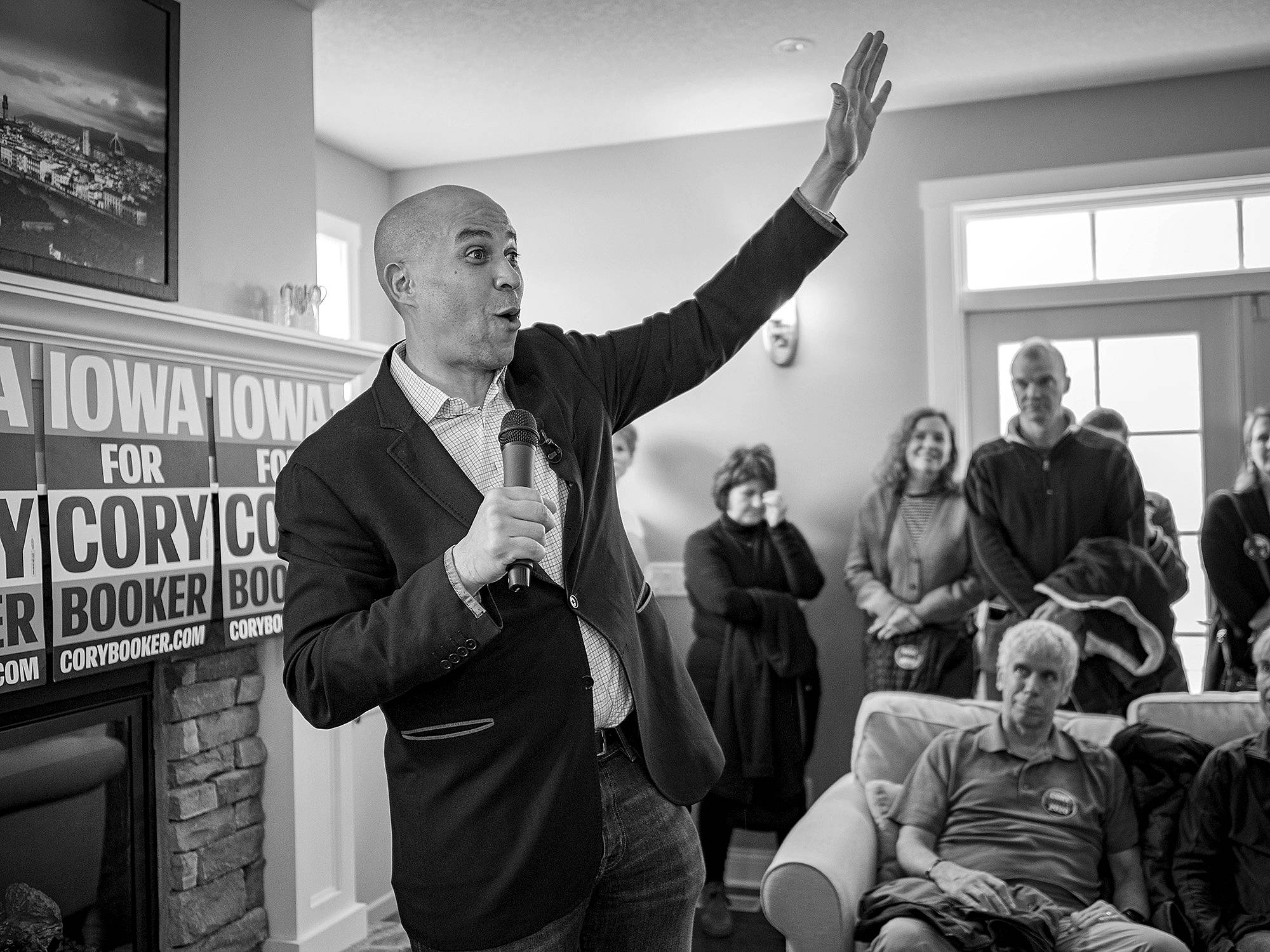 Jack Kurtz/Zuma Press                                 Sen. Cory Booker talks to guests at a campaign house party in Ankeny, Iowa, on December 31.