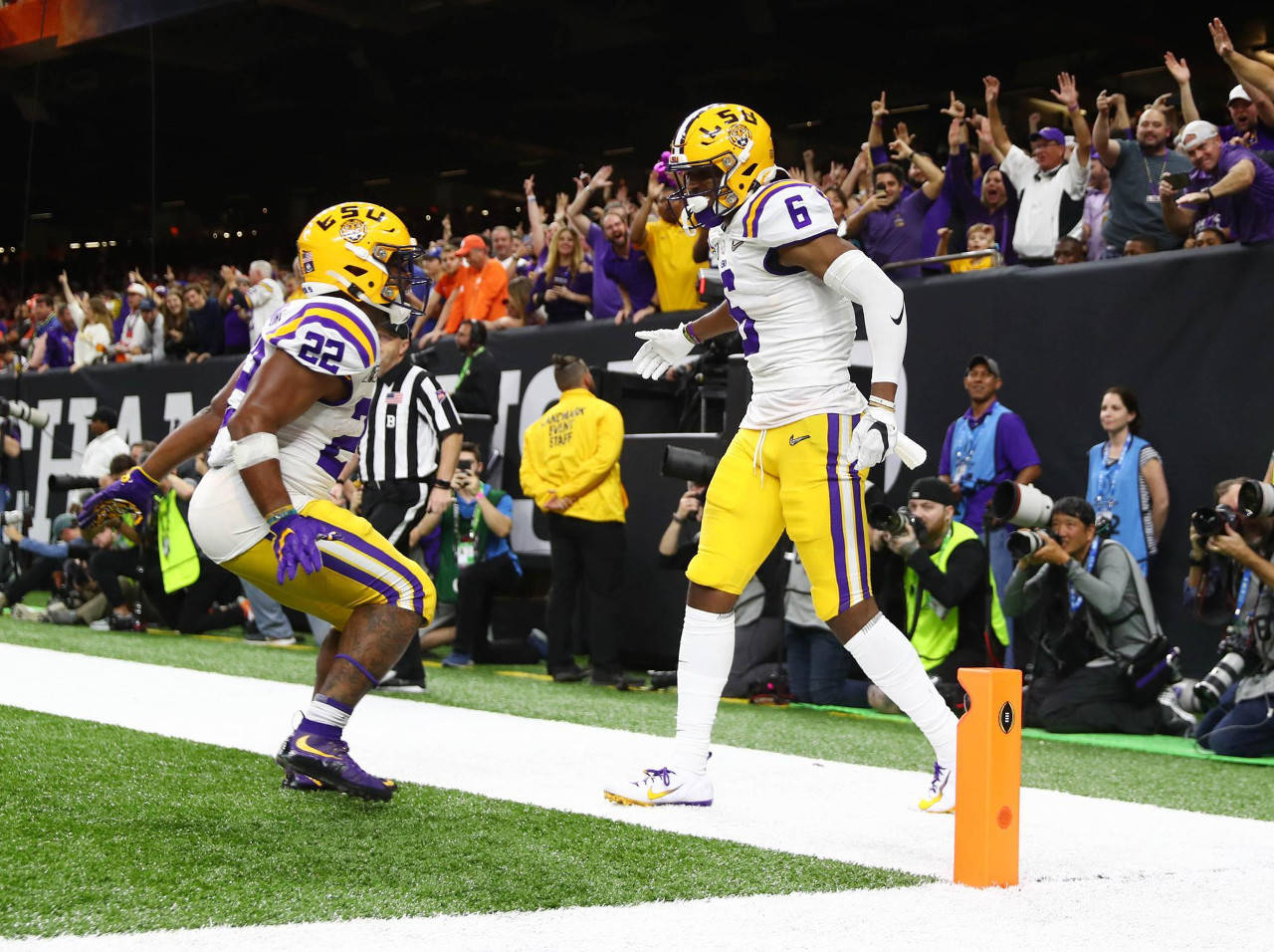 LSU Tigers wide receiver Terrace Marshall Jr. (6) celebrates with running back Clyde Edwards-Helaire (22) after scoring a touchdown against the Clemson Tigers in the fourth quarter in the College Football Playoff national championship game at Mercedes-Benz Superdome. (Mark J. Rebilas | USA Today Sports)
