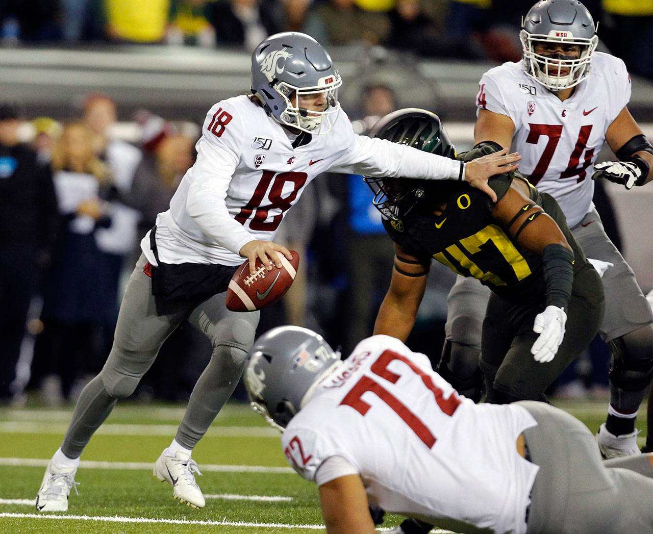 Washington State quarterback Anthony Gordon (18) scrambles as he tries to avoid a sack by Oregon linebacker Mase Funa during the second quarter on Oct. 27, 2019 at Autzen Stadium. (Andy Nelson | The Register-Guard)