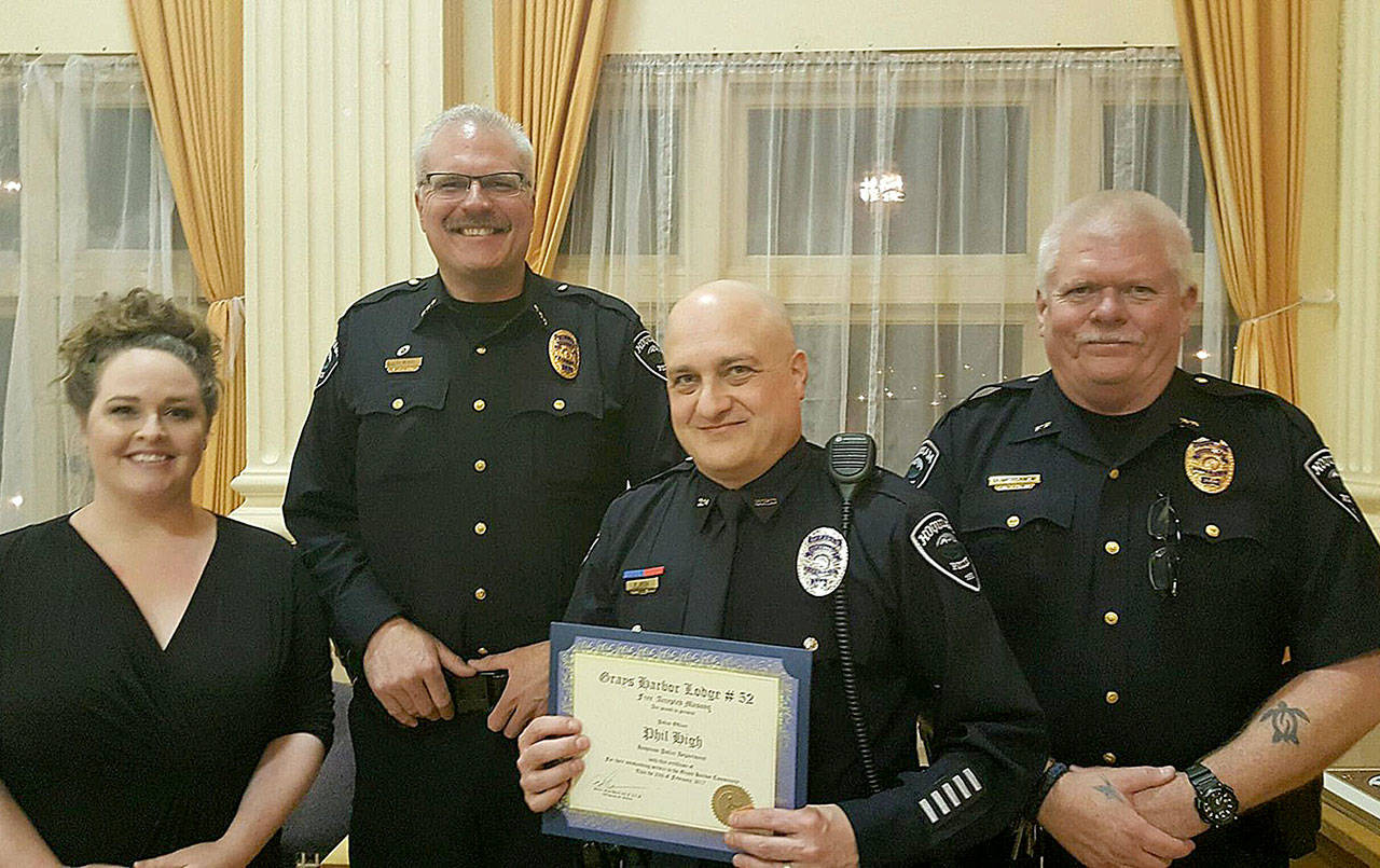 COURTESY PHOTO                                Hoquiam Police Officer Phillip High, second from right, was awarded the Grays Harbor Masonic Lodge Hoquiam Police officer of the year award in 2017. Also pictured from left are then-Hoquiam Mayor Jasmine Dickhoff, Hoquiam Police Chief Jeff Myers, and retired Hoquiam Police Deputy Chief Don Wertanen.
