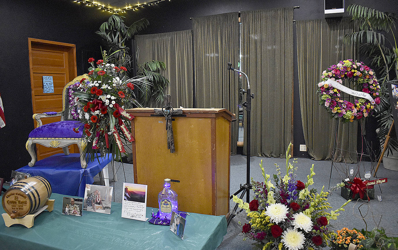 Photos by DAN HAMMOCK | GRAYS HARBOR NEWS GROUP                                Photos, flowers and memories were displayed on the stage at the Montesano Moose Lodge on Friday as the venue hosted the celebration of life for Chuck Caldwell.