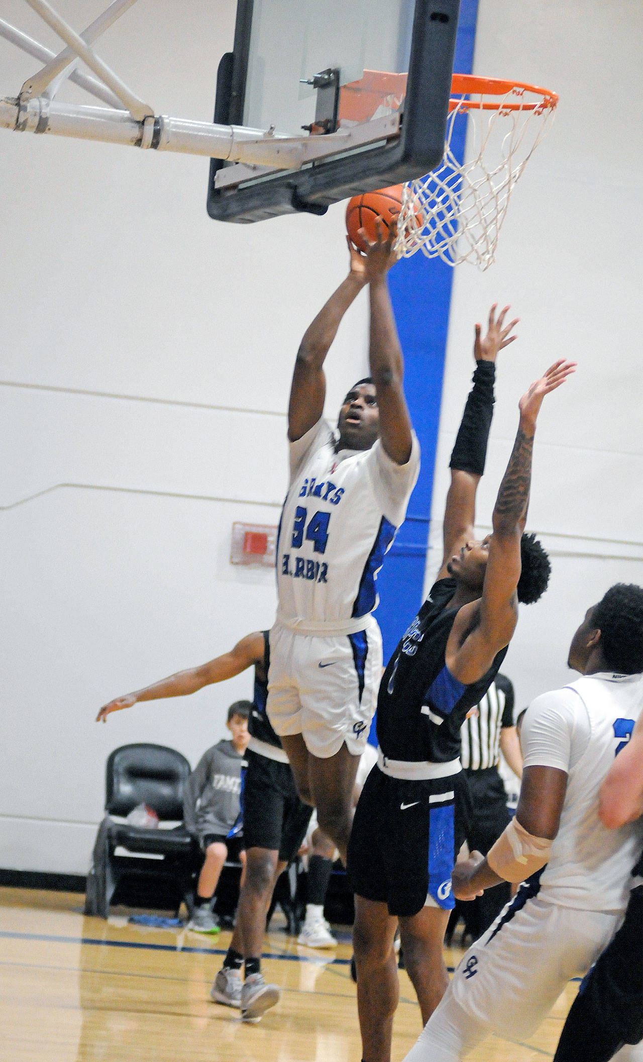 Grays Harbor’s Antoine Hines (34) goes up for a shot while South Puget Sound’s Branden Bunn defends during Saturday’s game in Aberdeen. (Ryan Sparks | Grays Harbor News Group)