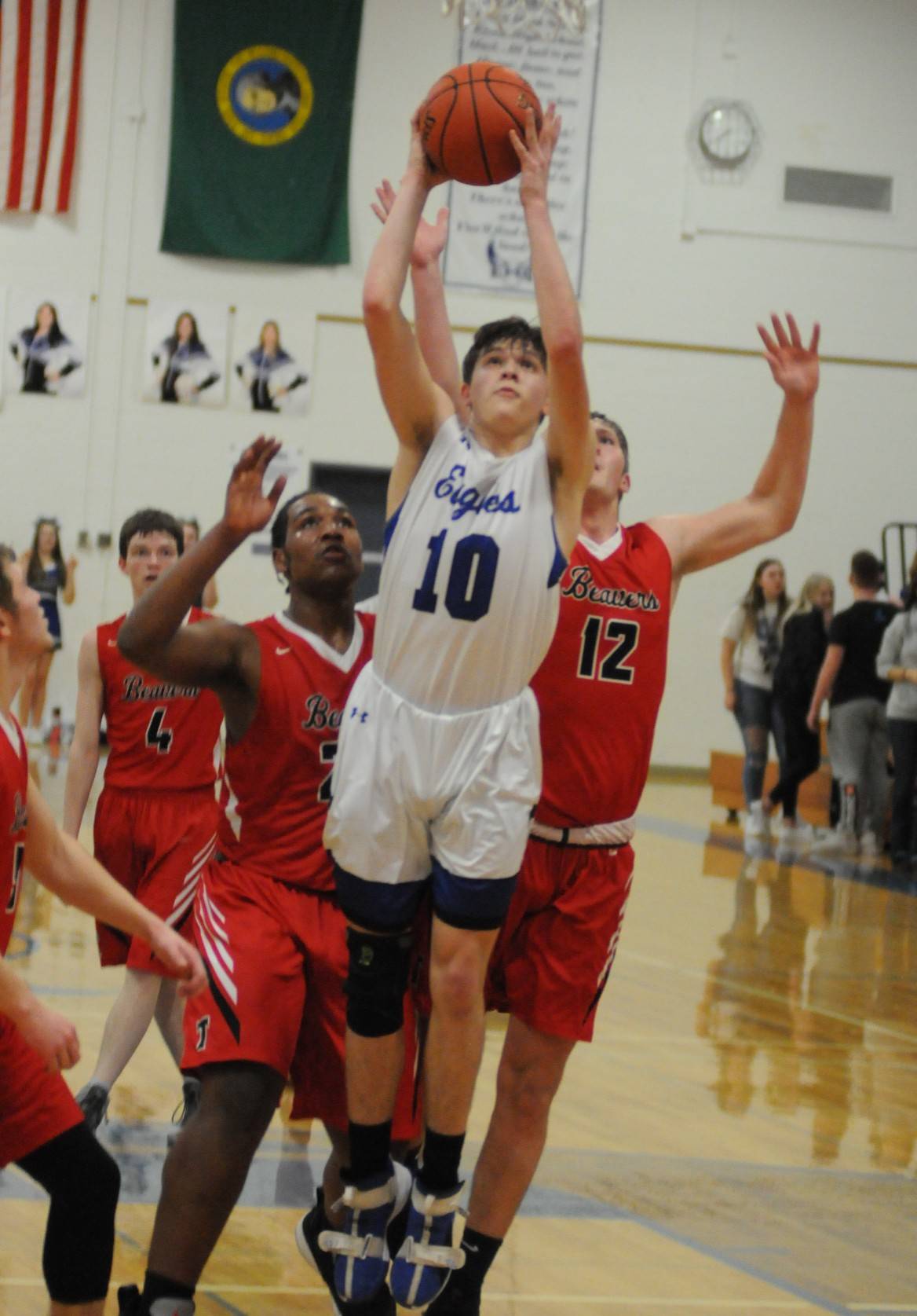 Elma’s Cobey Moore (10) is fouled by Tenino’s Paxton Russell (12) in the first half of the Eagles’ 65-48 win on Thursday at Elma High School. (Ryan Sparks | Grays Harbor News Group)
