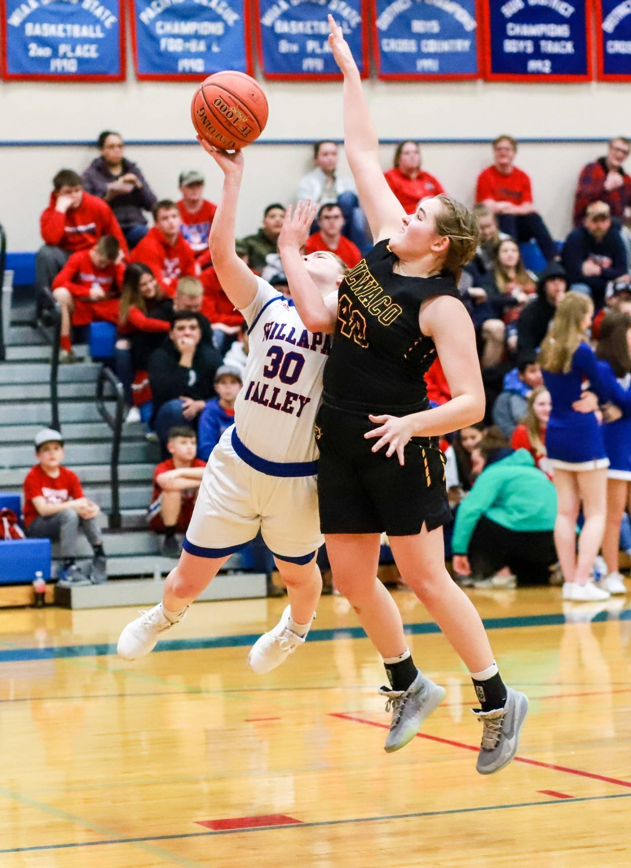 Willapa Valley’s Cami Swartz (30) puts up a shot against Ilwaco’s Kylie Gray during the Vikings’ 53-31 loss on Monday in Menlo. (Photo by Larry Bale)