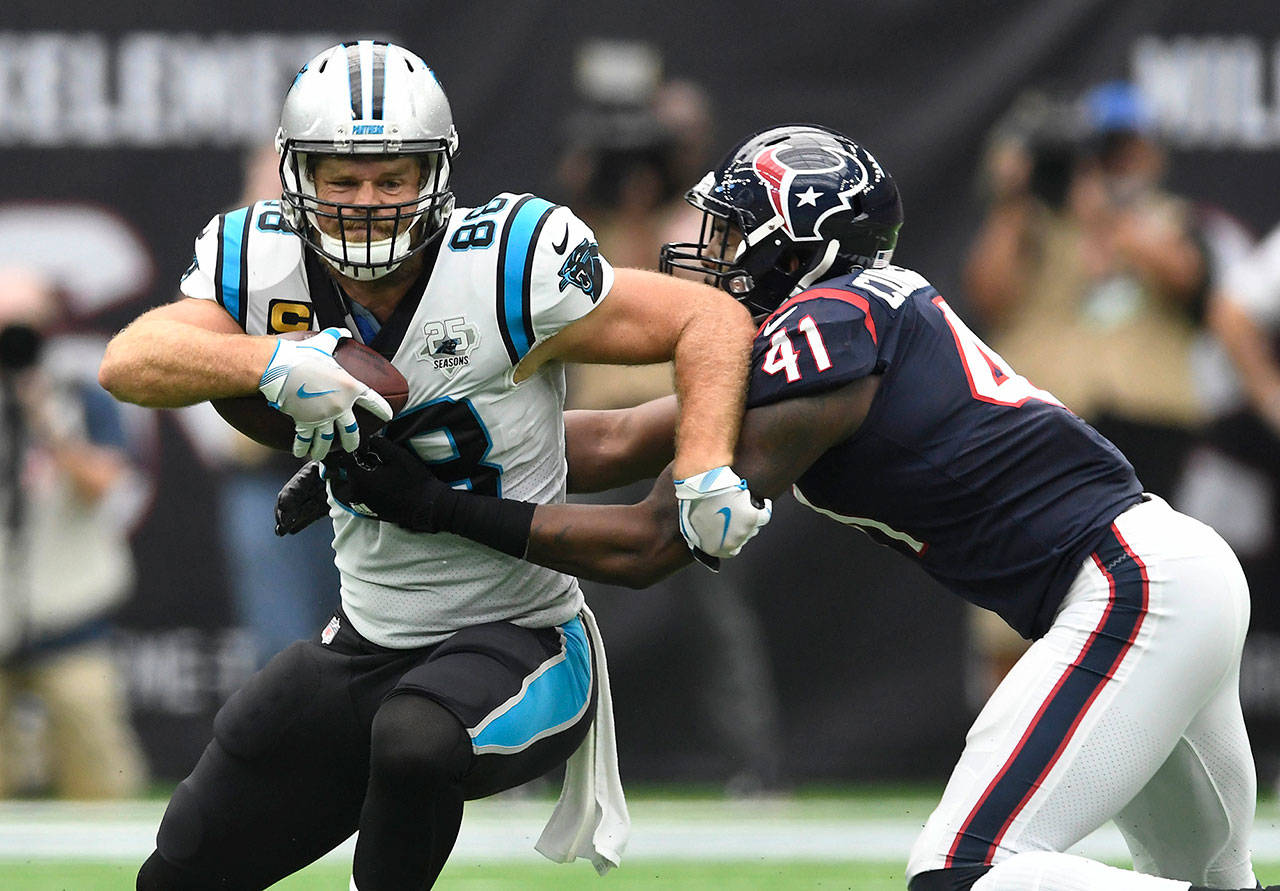 Carolina Panthers tight end Greg Olsen (88) makes a reception in front of Houston Texans linebacker Zach Cunningham (41) on Sunday, Sept. 29, 2019. Olsen was released by the Panthers on Monday. The Panthers won, 16-10. (David T. Foster III/Charlotte Observer/TNS)