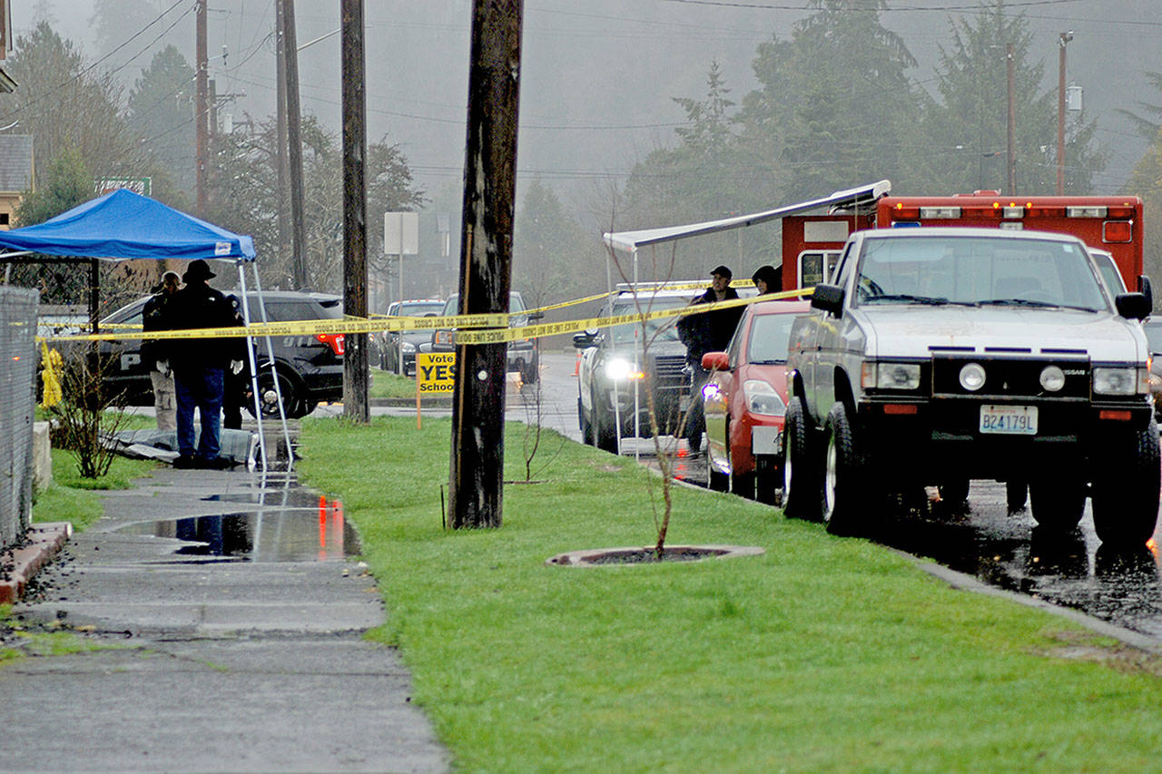 Aberdeen police work at a death investigation in the 700 block of East Market on Thursday morning. (Thorin Sprandel | Grays Harbor News Group)