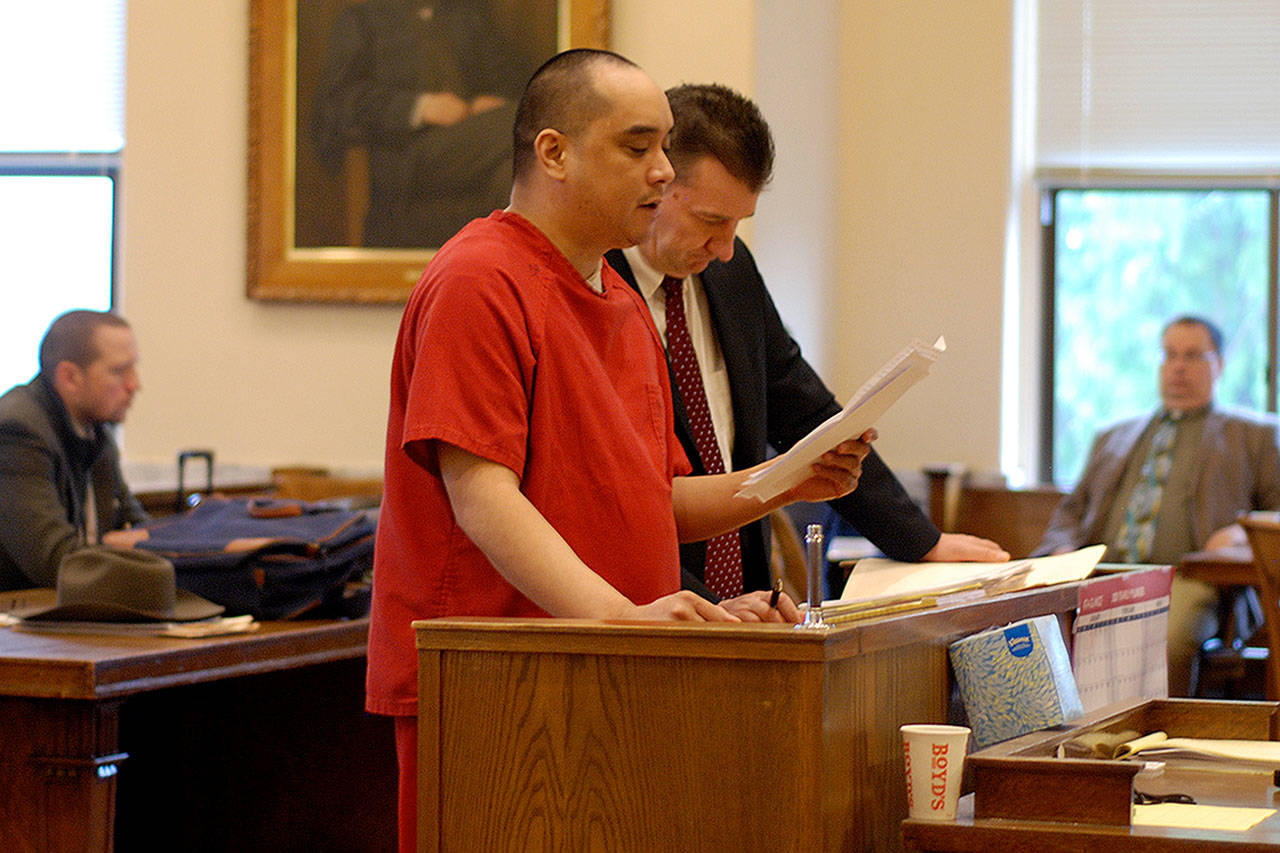 Edward Lugo reads a letter to the judge during his sentencing on Friday morning as his lawyer David Hatch stands by. (Thorin Sprandel | Grays Harbor News Group)