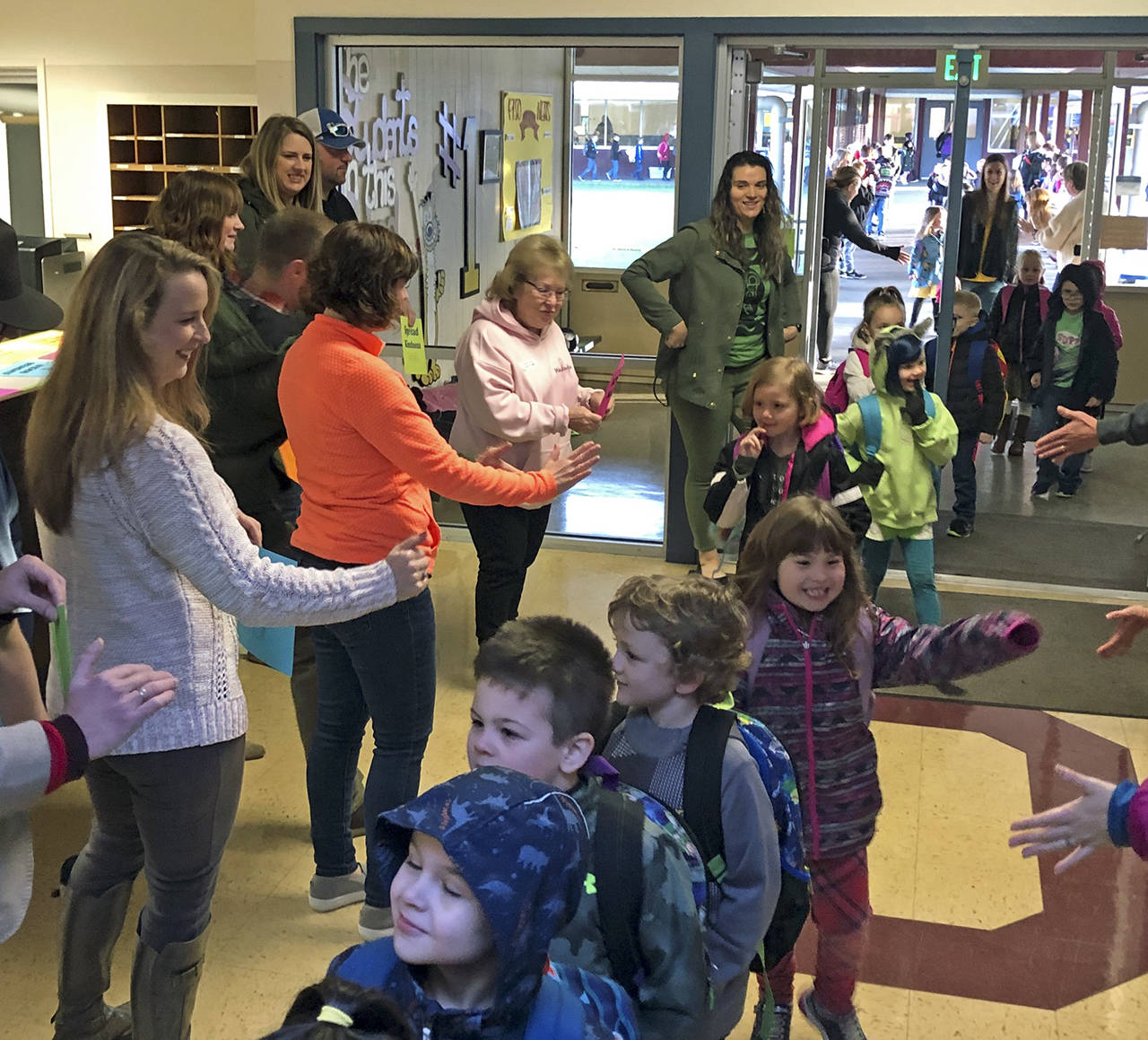 Courtesy photo                                The community and parents formed a “Kindness Tunnel” Feb. 3 to welcome students to Cosmopolis School with high fives, smiles, kind words and encouragement.
