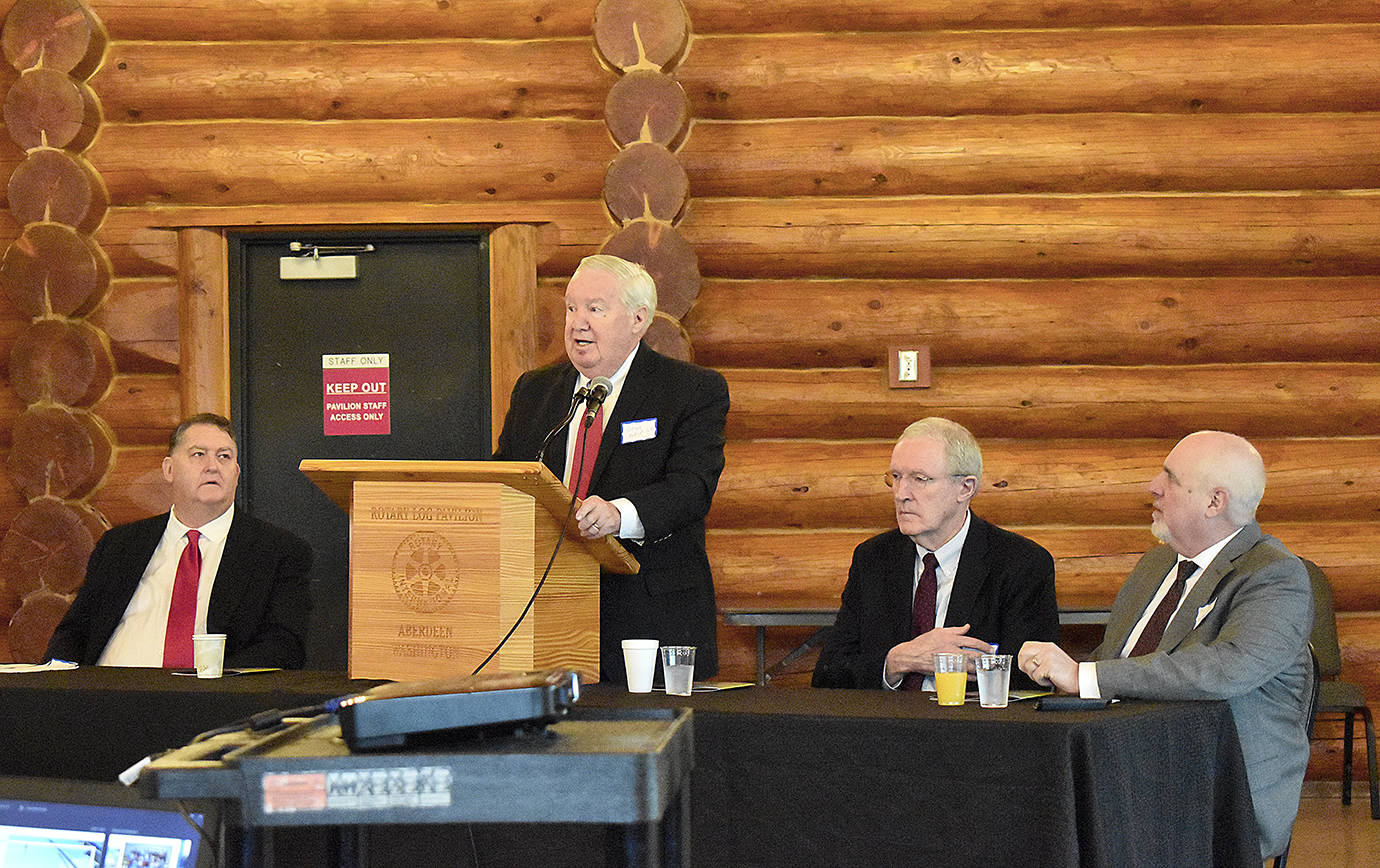DAN HAMMOCK | GRAYS HARBOR NEWS GROUP                                 Port of Grays Harbor Commission President Stan Pinnick delivers his remarks at the Port’s annual business report breakfast Wednesday. From left are Port Executive Director Gary Nelson, Pinnick, and Port Commissioners Tom Quigg and Phil Papac.