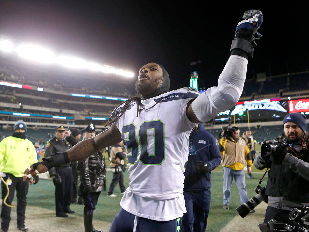 Seattle Seahawks DE Jadeveon Clowney (90) celebrates a 17-9 win after knocking out Philadelphia Eagles QB Carson Wentz in an NFC playoff game on Jan. 5. Signing Clowney, who is a free agent, to a contract is a top priority for the Seahawks this offseason. (Tribune News Service)