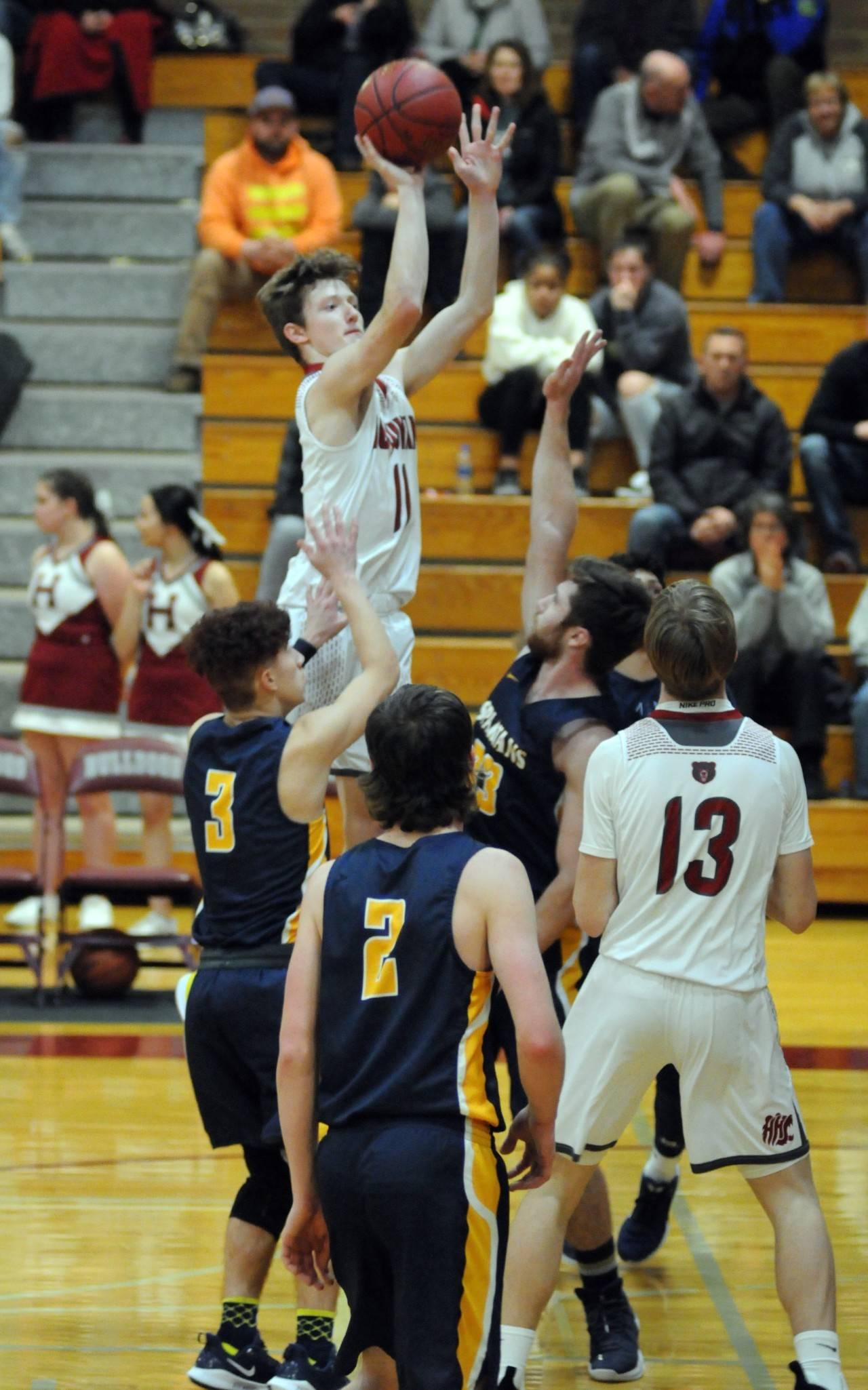 Hoquiam’s Cameron Bumstead (11) rises for a jump shot in the Grizzlies’ season-ending 58-49 loss to Forks in a 1A District 4 consolation game on Tuesday at Montesano High School. (Ryan Sparks | Grays Harbor News Group)