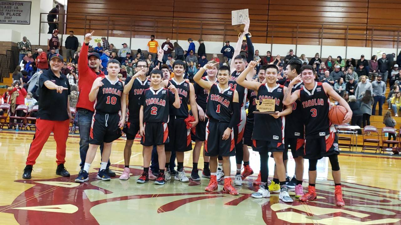 The Taholah Chitwhins were all smiles on Thursday after defeating Naselle 58-53 to win the 1B District 4 Tournament at Montesano High School. (Ryan Sparks | Grays Harbor News Group)