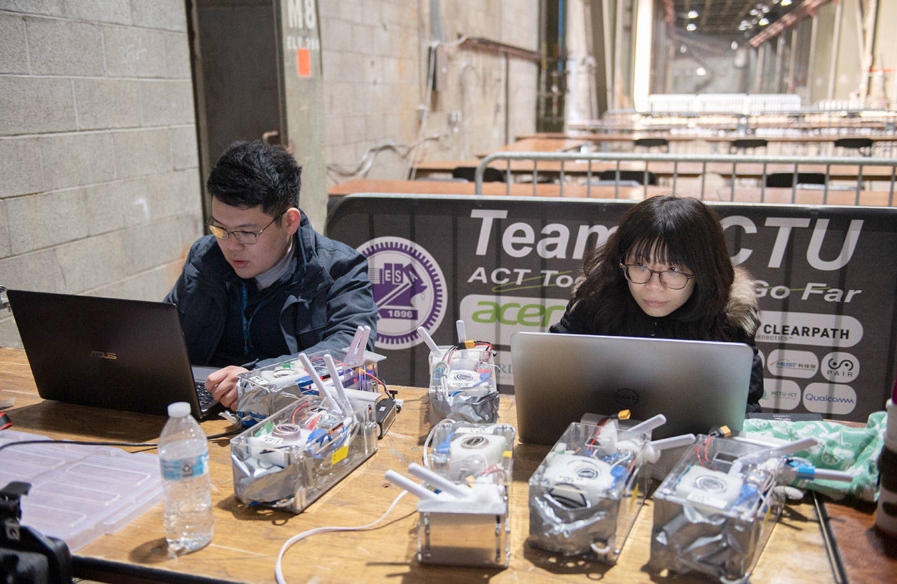 Technicians for team CTU-CRAS-NORLAB work at their computers recently at the DARPA Subterranean Challenge Urban Circuit competition at the Satsop Business Park in Grays Harbor County. (Photo courtesy Defense Advanced Research Projects Agency)