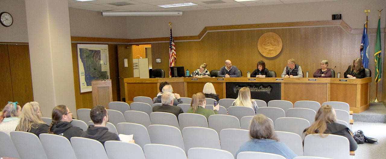 Michael Lang | Grays Harbor News Group                                 A crowd of about 12 people gathers to witness the Grays Harbor Board of County Commissioners’ workshop Tuesday, Feb. 25, 2020, in Montesano. Seated at the dais from left are Jenna Amsbury, clerk of the court; Commissioner Wes Cormier; Commission President Vickie Raines; Commissioner Randy Ross; Norma Tillotson, deputy prosecuting attorney; and Tracey Munger, civil deputy prosecuting attorney.