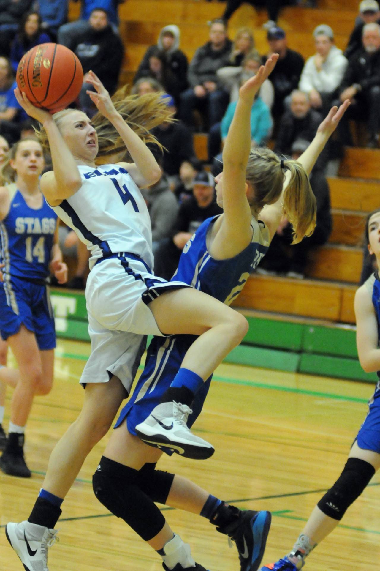Elma guard Jillian bieker (4) drives to the basket against Deer Parks Anna Patterson during the Eagles 39-38 win in the 1A Girls Basketball Regionals on Saturday at Tumwater High School. (Ryan Sparks | Grays Harbor News Group)