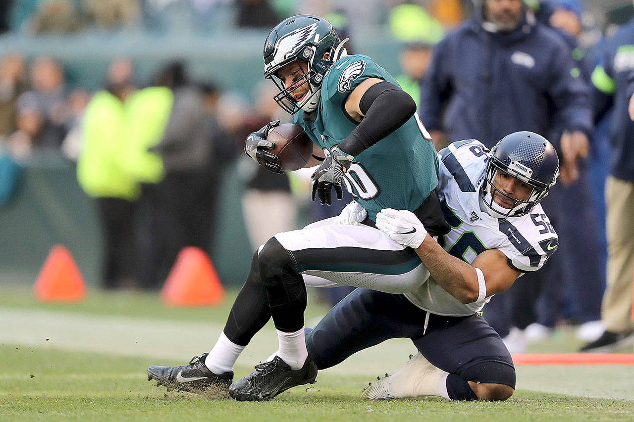 Philadelphia Eagles tight end Zach Ertz (86) is tackled by Seattle Seahawks linebacker Mychal Kendricks (56) in a game on Sunday, Nov. 24, 2019 in Philadelphia, Pa. Kendricks is one of 18 unrestricted free agents on the Seahawks’ roster. (Elsa/Getty Images/TNS)