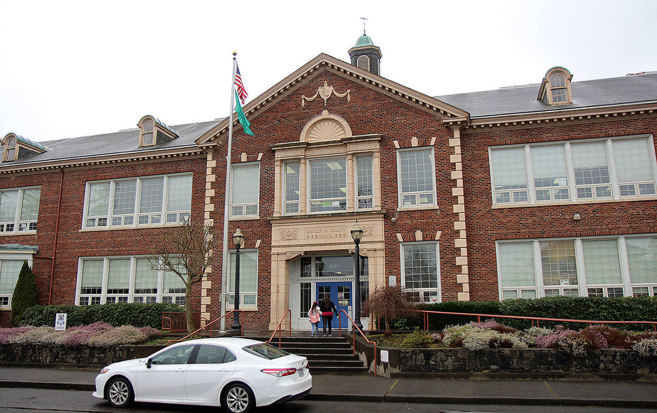 A student and parent head Friday, March 13, 2020, into the Charles McDermoth Elementary School in Aberdeen. (Michael Lang | Grays Harbor News Group)