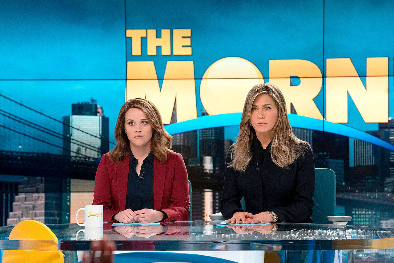 Reese Witherspoon, left, and Jennifer Aniston in a scene from the Apple TV+ series “The Morning Show,” which has suspended production due to coronavirus fears. (Apple TV+)