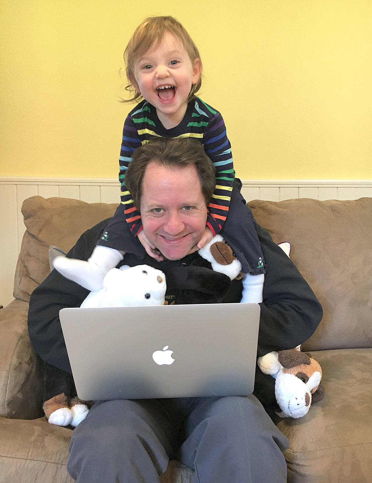 Andrew Gaines of Grays Harbor College has his hands full working from home with his 2-year-old daughter, Shayna. (Photo by Michelle Gaines)
