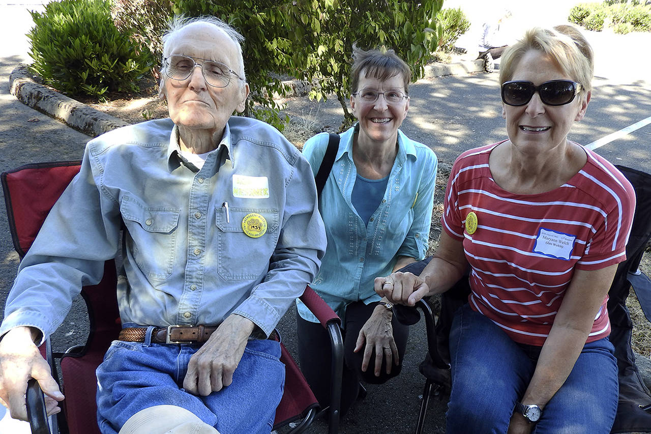 (Kat Bryant | The Daily World) In this photo taken in August of 2018, Lou Messmer (Class of 1937), left, sits with daughters Karen Messmer (Class of 1973) and Maryann Welch (Class of 1969) at the All Class Reunion. Lou was the oldest Aberdeen High School alum at the event, according to organizer Becky Carossino. He and his daughters represent two of their family’s four generations of AHS attendees, as both of Maryann’s children graduated in the 1990s and a granddaughter is set to graduate in 2020.