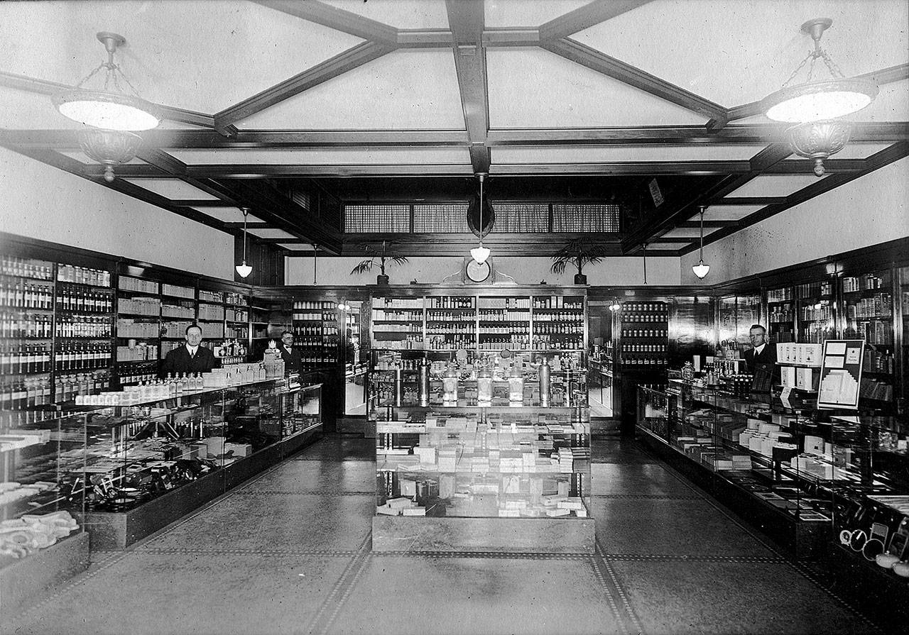 Patrons at Ossie Heikel’s drug store in the First National Bank building sought to purchase medications advertised to prevent influenza.