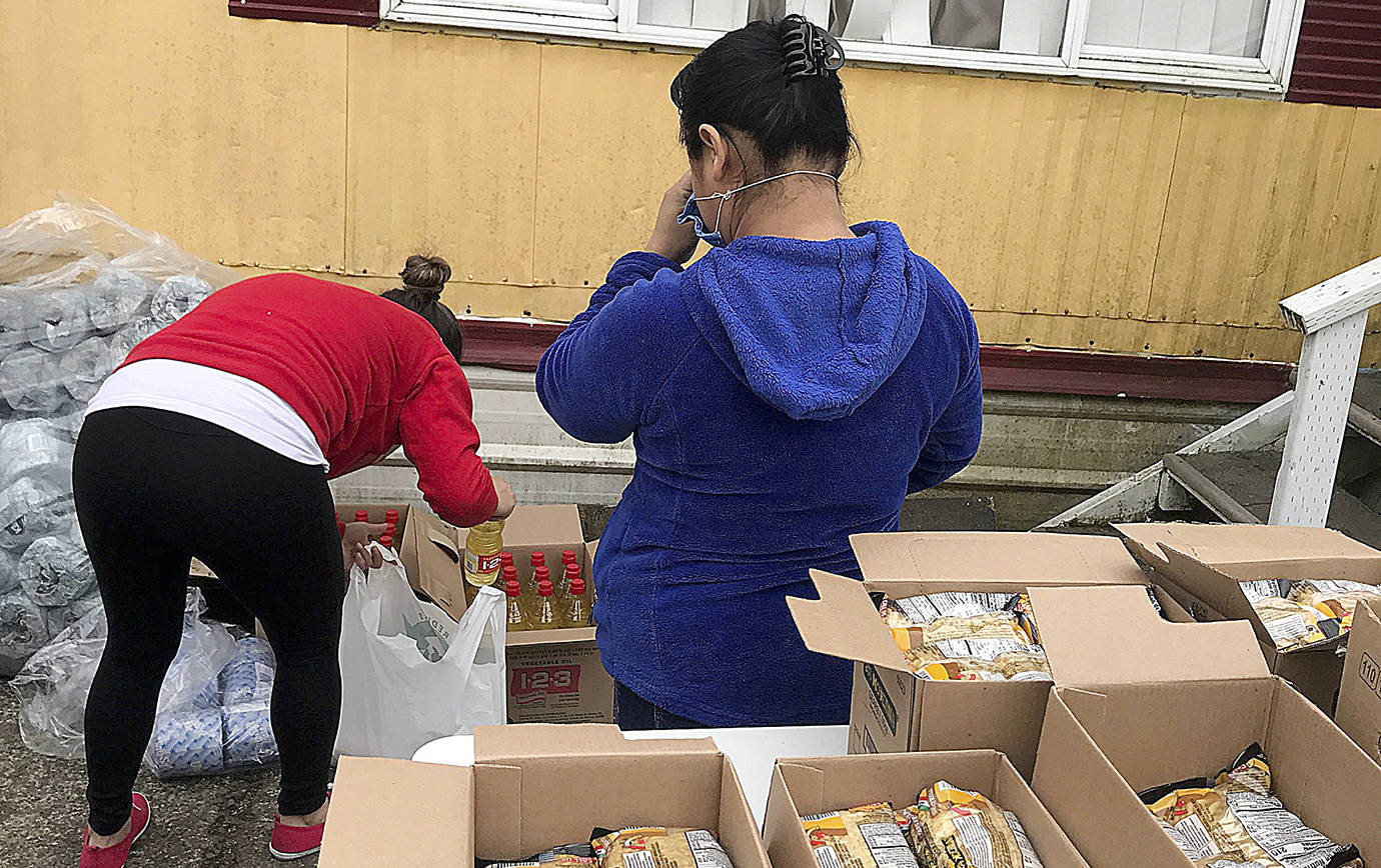 COURTESY PHOTO                                 Food bank information was shared and food, including food donated by small local businesses, was delivered to out-of-work families during the May 2 caravan organized by Firelands Workers United.