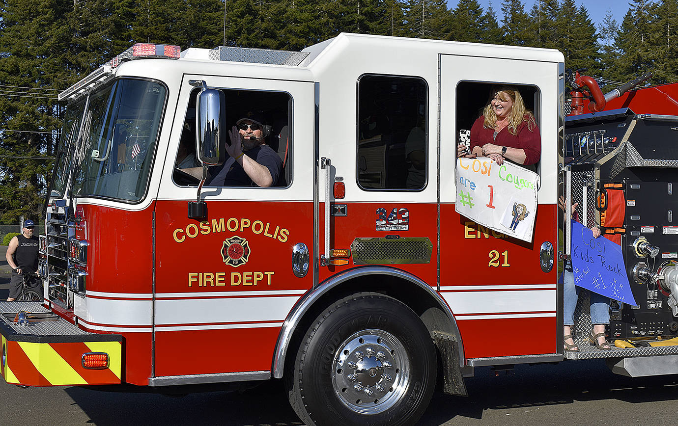 DAN HAMMOCK | GRAYS HARBOR NEWS GROUP                                 Cosmopolis’ new fire truck led a parade through the town Friday to show appreciation to the local students and families.